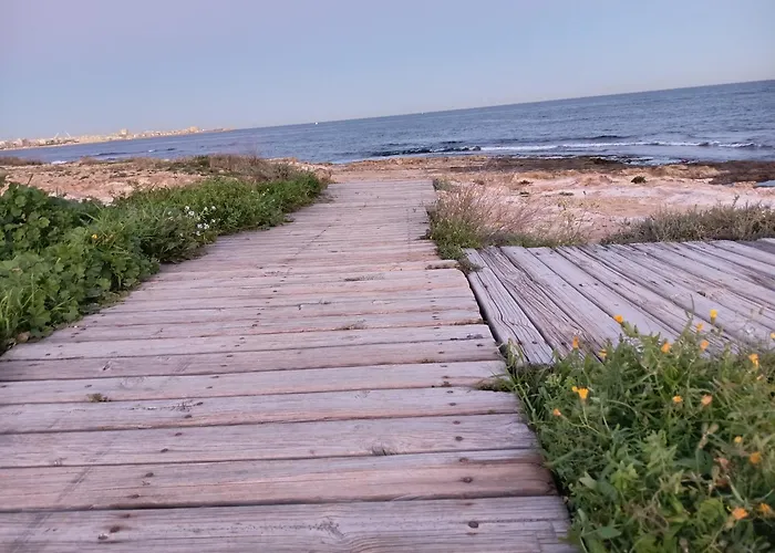 En primera línea de mar, casa,patio solarium La Bugamvulla Torrevieja